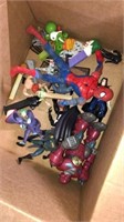 Group of Pez dispensers, action figures, and