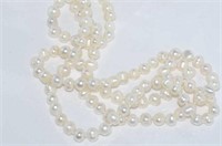 Long strand of white pearls