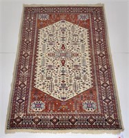 Oriental rug, tan and rust colors, 75" x 51"