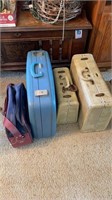 Assorted vintage luggage