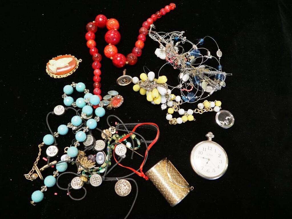 Container of costume jewelry including pocket