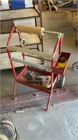 Vintage red paper holder, on wheels