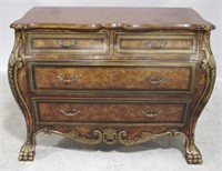 Decorative carved bombe chest