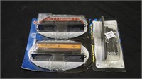 Three non-powered train collectables in box.