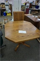 solid oak dining table with 2-20" leaves