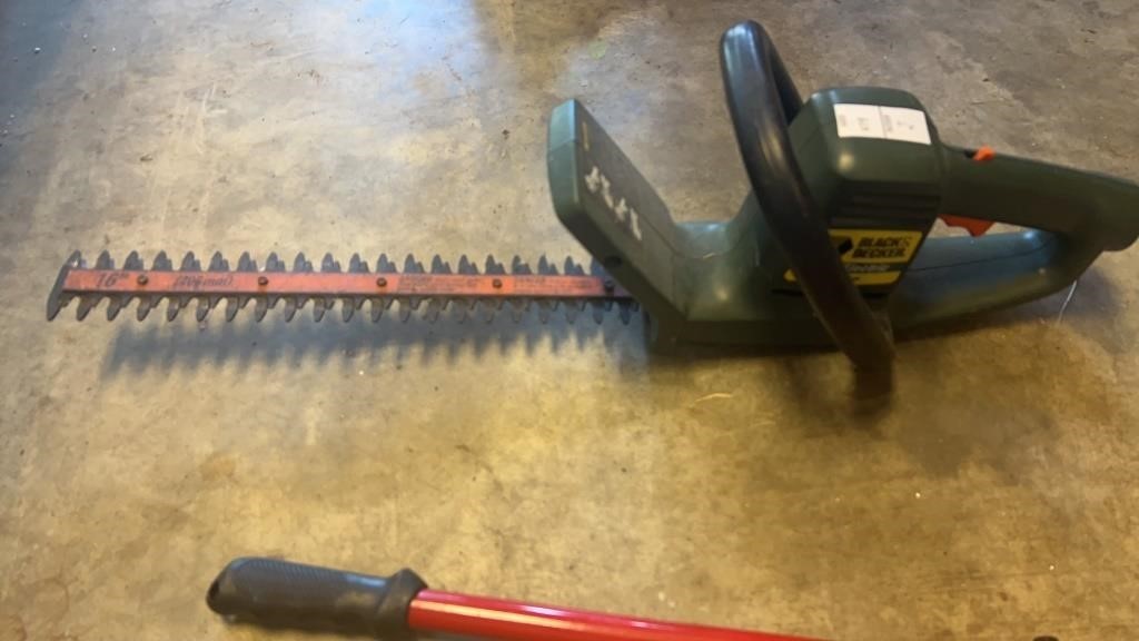 Black and Decker electric hedge trimmer and bolt