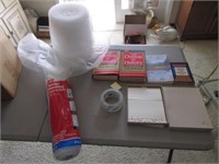 bubble wrap,plastic wrap,tape & books