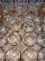 Leaf/grape pattern glasses & textured goblets.