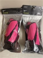 2 pairs of Nike Charge Youth Guards. Size L.