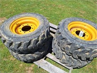 (4) 10-16.5 Skidsteer Tires/Wheels (Good)