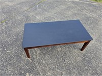 BROWN AND BLACK COFFEE TABLE