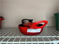 Two red Le Crueset cookware - petite with lid & do