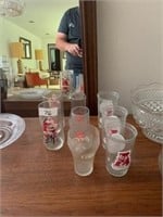 LOT OF COKE AND SEVEN-UP GLASSES