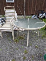 Glass top patio table and three chairs
