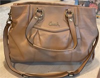 Medium size leather, beige coach handbag