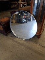 Round metal framed wall mirror