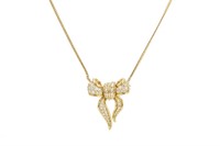 18K YELLOW GOLD AND DIAMOND BOW NECKLACE, 18.9g