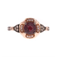 A Lady's Levian Garnet and Diamond Ring in 14K