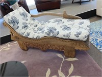 Ornately carved wooden chaise