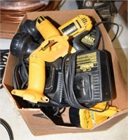 Box of DeWalt cordless power tools and chargers