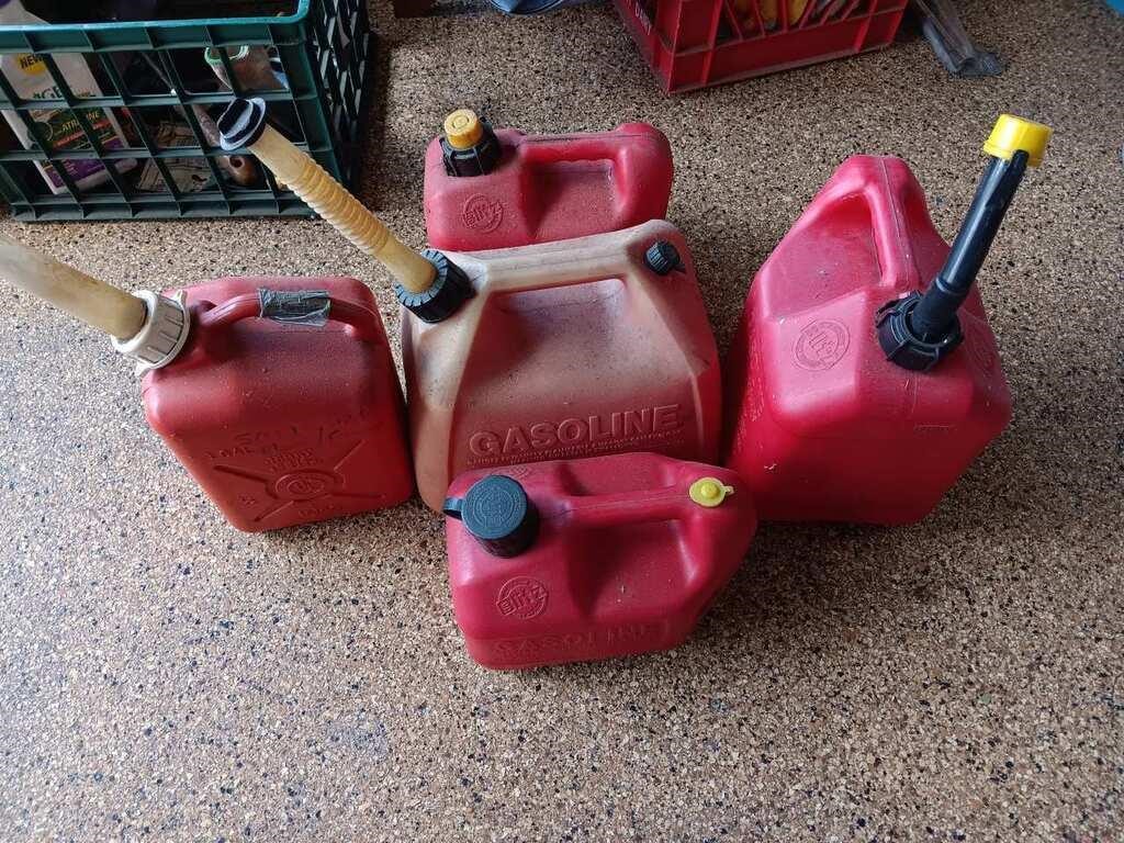 Lot Of 5 Gas Cans W/ Unknown Contents