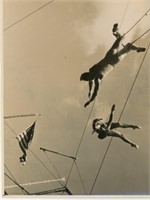 8x10 Trapeze artists doing in air stunt