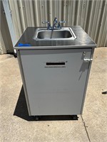 Portable sink with hot water heater on casters