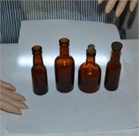 Lot of 4 small amber bottles