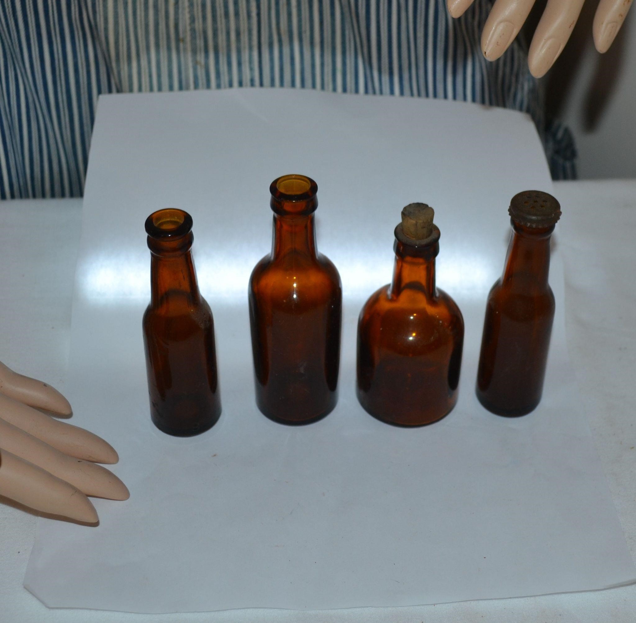 Lot of 4 small amber bottles