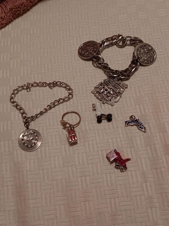 2 charm bracelets, charms and a ring.