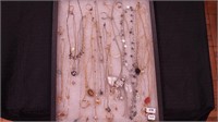 A container of costume jewelry: Whiting