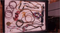 A container of costume jewelry: Chico's