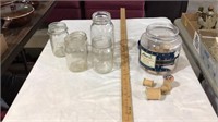 Glass jars, sewing string spools