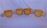 7 Fiesta teacups: 4 yellow, 2 turquoise, 1 cobalt