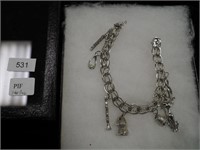 Sterling 8" charm bracelet with seven charms