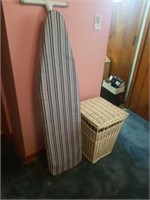 23" WICKER CLOTHES BASKET AND A IRONING BOARD