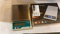 1 Lot - 2 Kitchen Scales 1 New and 1 Used.