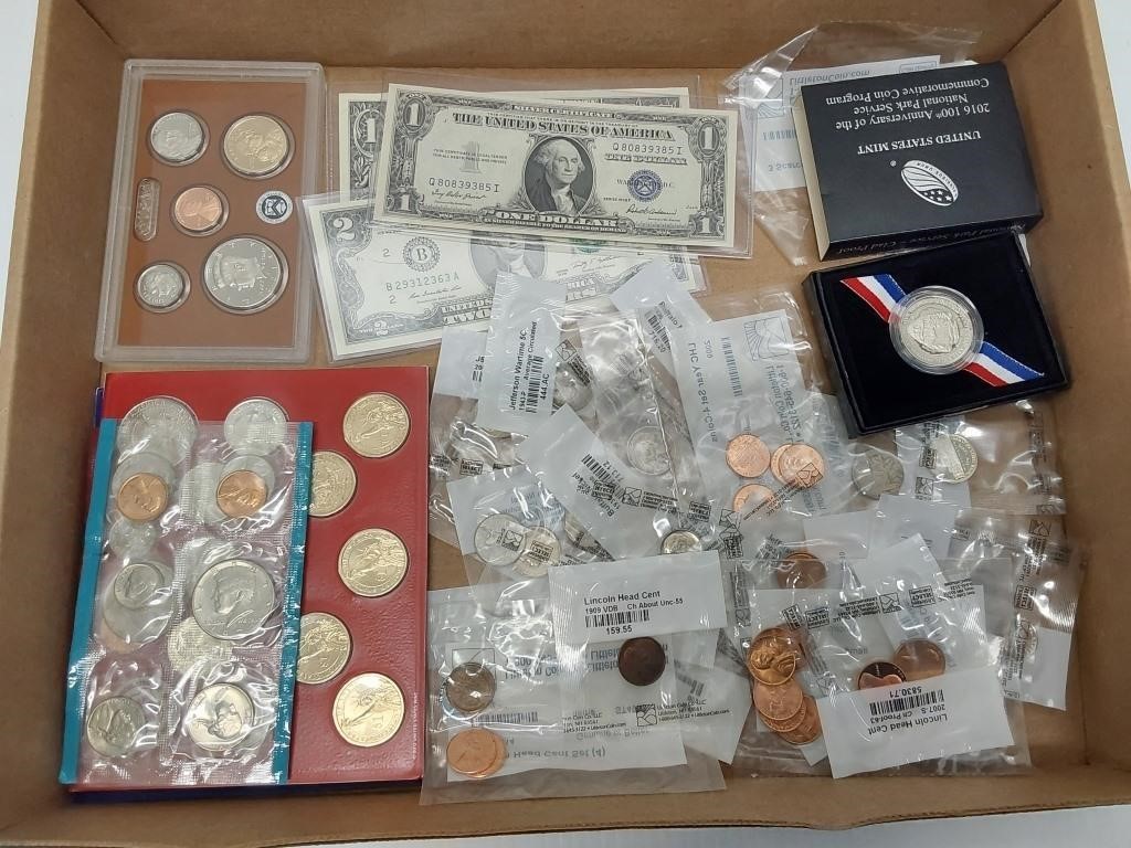 flat of miscellaneous coins and currency