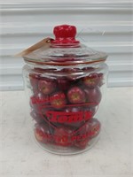 Tom's toasted peanut glass jar full of fake apples