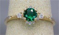 14K RING WITH DIAMONDS AND LAB GROWN EMERALD.