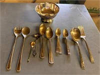 Assorted silver-plated utensils and bowl