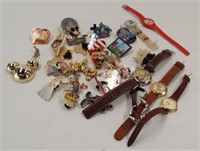 A variety of Disney pins and watches including