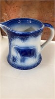 VINTAGE GLAZED POTTERY BLUE AND WHITE COW PITCHER