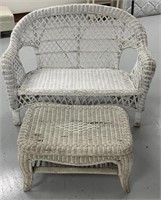 Wicker love seat and small bench table