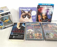 DVD movies, Funko Pop, a novel, and a calendar