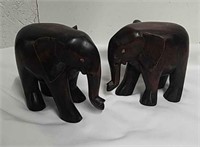 Two 5-in wooden elephants
