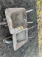 (2) ANTIQUE METAL WHEELBARROWS (1 HAS A STEEL