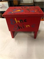 Shoe shine box with some items inside