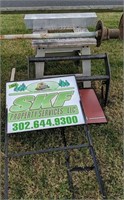 Metal Tool Stand, Signs, Truck Brush Guard. On