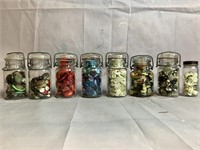 Various Un Researched Buttons in Clear Glass Jars